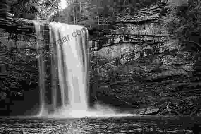 A Black And White Photograph Of A Towering Waterfall, Showcasing The Dramatic Contrast Between Light And Shadow And The Power Of Water To Shape The Landscape. Light And Color In The Outdoors