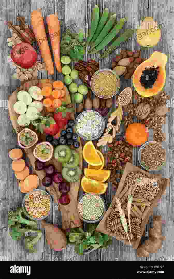 A Colorful Arrangement Of Fresh Fruits, Vegetables, Whole Grains, Nuts, And Legumes On A Wooden Table, Representing The Diversity And Abundance Of A Plant Based Diet. Healing The Vegan Way: Plant Based Eating For Optimal Health And Wellness