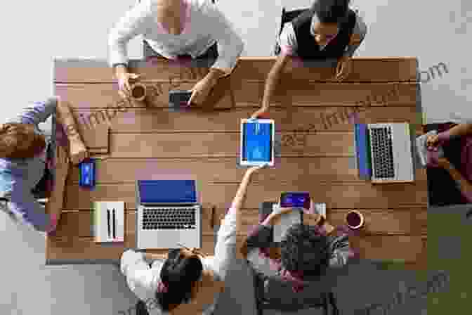 A Group Of People Working Together Around A Table, Smiling And Discussing Ideas The Undefeated Marketing System : How To Grow Your Business And Build Your Audience Using The Secret Formula That Elects Presidents