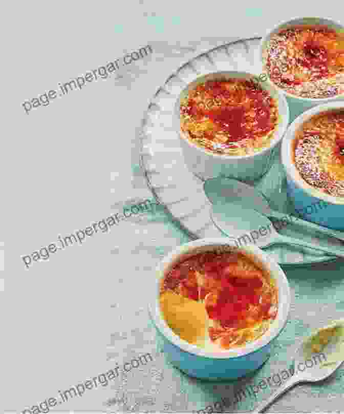 A Plate Of Crème Brûlée, A Classic French Dessert With A Creamy Custard Base And A Caramelized Sugar Topping. Famous Iconic French Dishes: French Cuisine: French Culinary Phrases